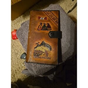 handmade, tooled leather souvenir wallet or document holder from Per